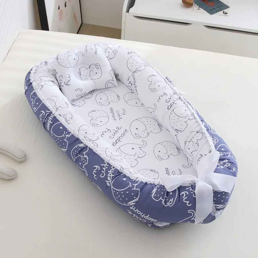 reducteur-de-lit-bleu-motif-dessin-elephant-lecocon
