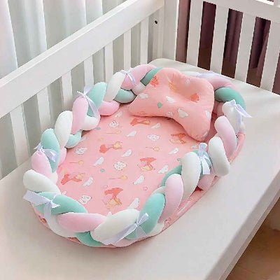 reducteur-de-lit-pour-bebe-nid-rose-tresses-pastel-confort-douceur-berceau-securise-velours-de-paix