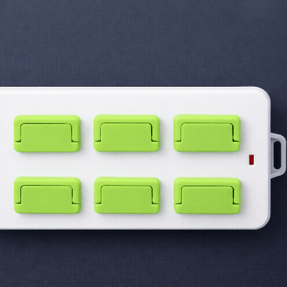 cache-prise-pour-bebe-vert-multiprise-six-caches-vue-dessus-cocoon-electra