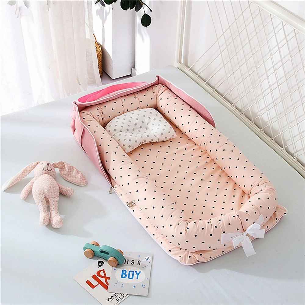 reducteur-de-lit-6-12-mois-rose-pointille-nurserie-peluche-nid-de-serenite