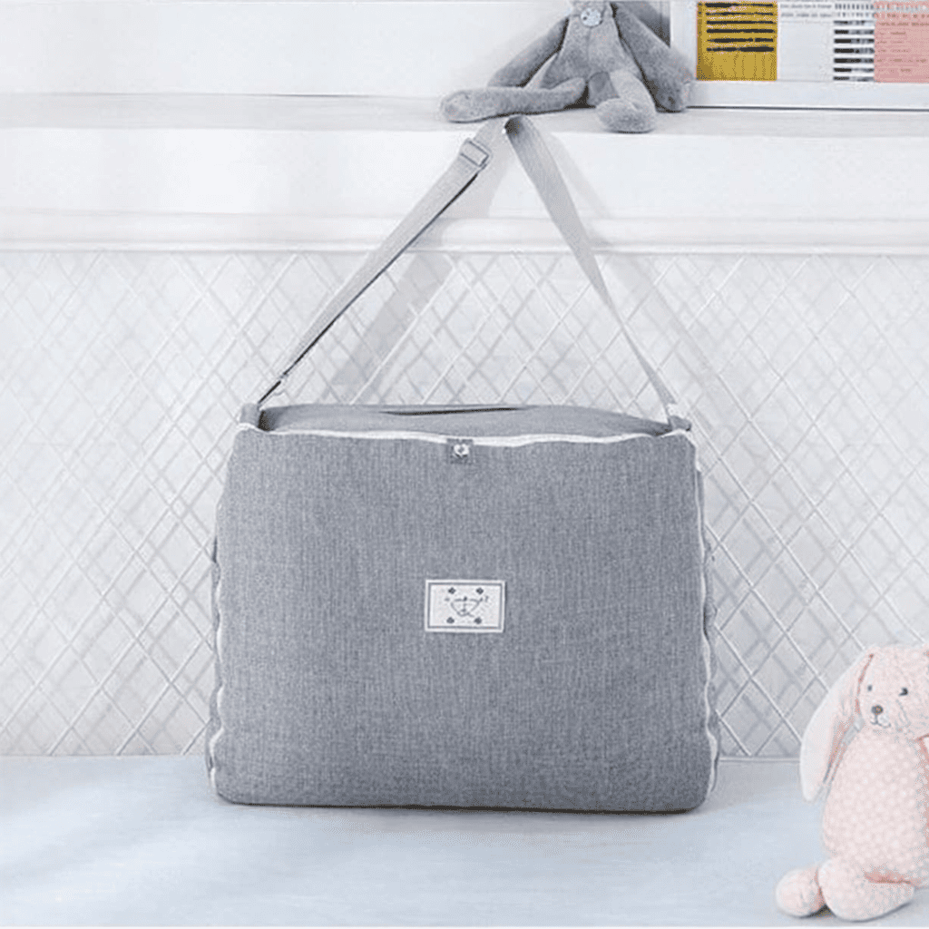 reducteur-de-lit-6-12-mois-sac-gris-range-nurserie-peluche-nid-de-serenite