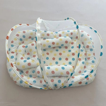 reducteur-de-lit-jukki-motif-pois-multicolore-vue-dessus-douillet-rosee-douce
