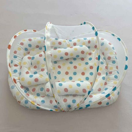 reducteur-de-lit-liewood-motif-pois-multicolores-vue-dessus-moustiquaire-ombre-douce