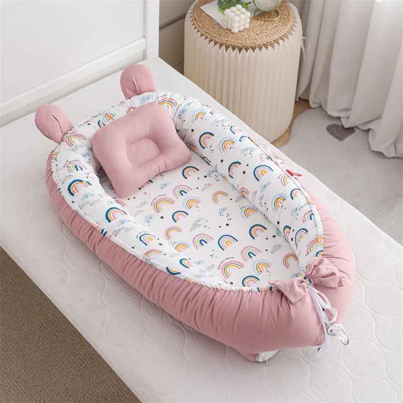 reducteur-de-lit-nid-bebe-rose-arcs-en-ciel-coussin-chambre-decoration-confort-brume-de-repos