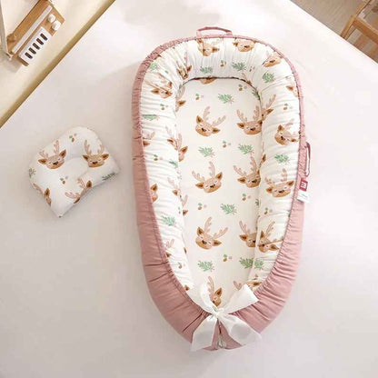 reducteur-de-lit-rose-fond-blanc-motif-lapins-NidCoton
