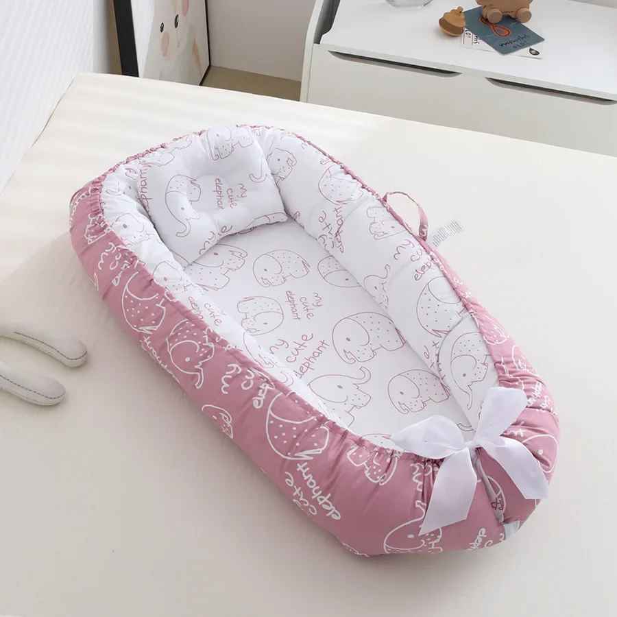 reducteur-de-lit-rose-motifs-dessin-elephant-lecocon
