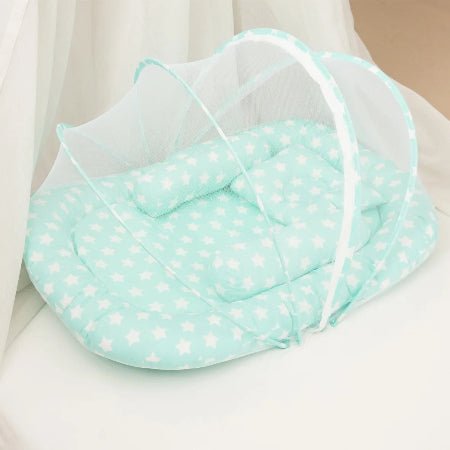 reducteur-de-lit-vert-baudet-motif-etoiles-blanches-menthe-flocon-de-paix
