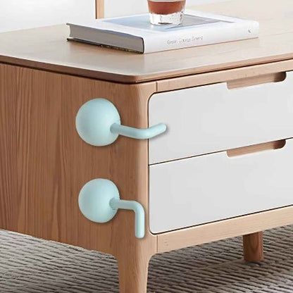 securite-placard-verrous-boule-vert-menthe-sur-tiroirs-commode-bois-pince-douceur